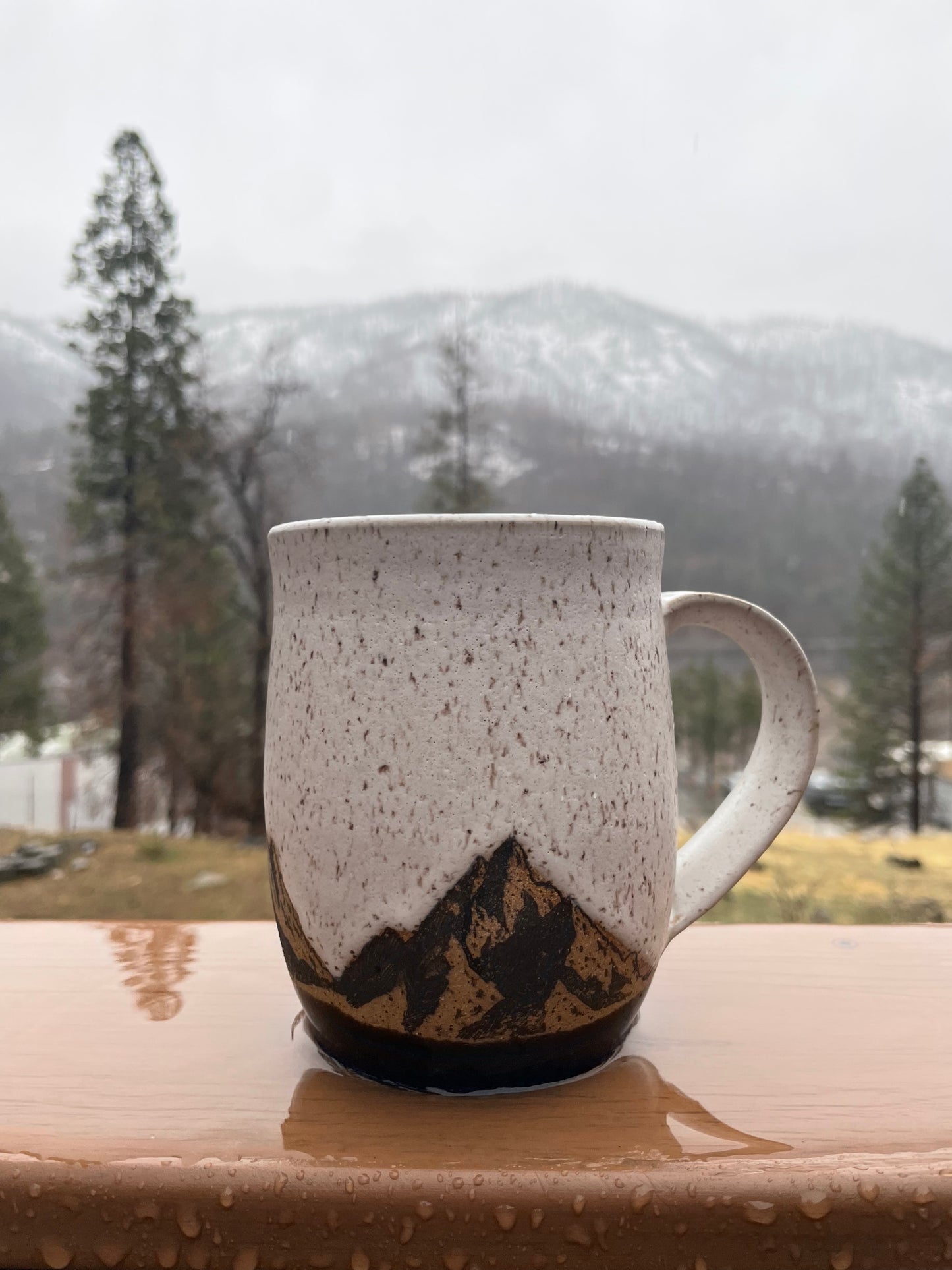 Nature lovers coffee mug in the rain.